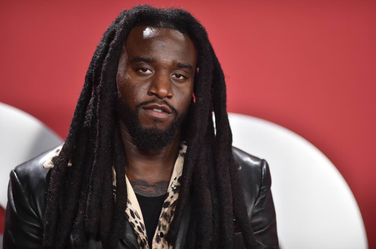 Shaboozey leans into bold texture with a full leather suit and cheetah-print shirt.