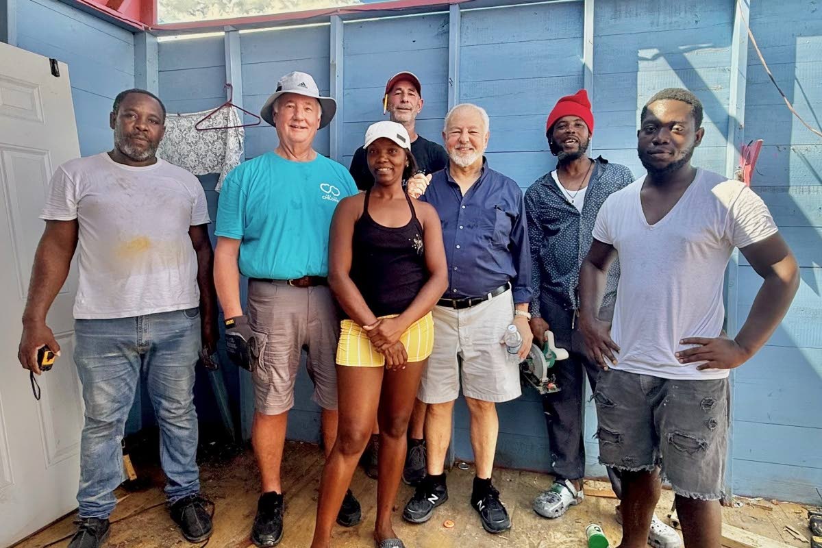 Paul Issa, chairman of the Issa Trust Foundation, along with Rob Barkema, Advisory Board member and volunteer Dirk Bartolazzi of Bartolazzi Homes and Couples Swept Away employee, Tishon Wilson and her colleagues from the Maintenance Department take a break