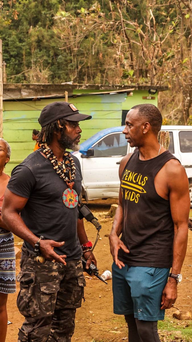 Pencils4Kids CEO Randy Griffiths (right) and Accompong Maroons Chief Richard Currie in dialogue in Quickstep, St Elizabeth.