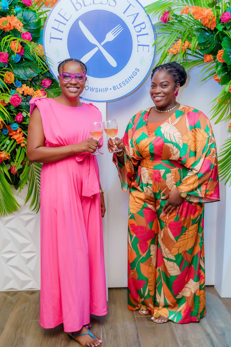 Tishaun Edwards (right), manager of The Bless Table, and Makeda Lalor, managing director of PeoplePlus Management, raise a toast.