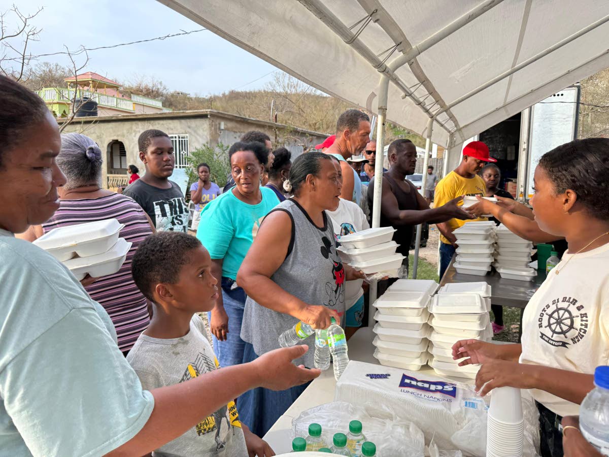 St Elizabeth residents receive meals from the mobile kitchen of Portland-based Roots 21 restaurant.