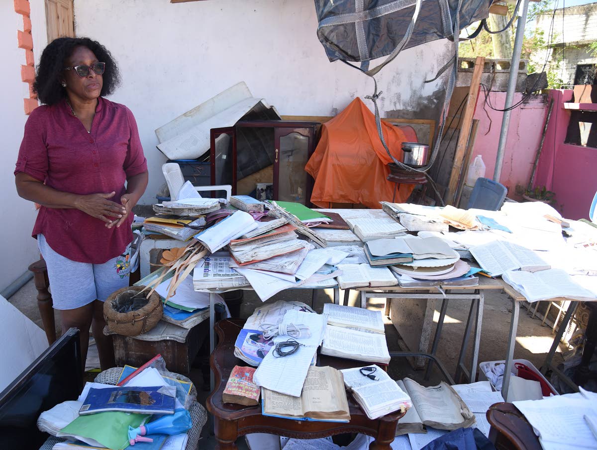
Frome Technical High School guidance counsellor Hyacinth Headley-Lewin looks at the destroyed tools of her trade in what’s left of her garage. She recalled having to flee her house as floodwaters rose during the passage of Hurricane Melissa.