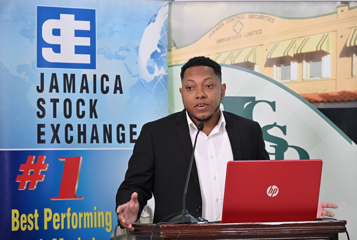 The winner of the 2024/2025 Market Research Competition, Barita Investments Limited Senior Investment Banking Analyst, Sean Davidson, addresses the Jamaica Stock Exchange Market Research Awards on November 20 at the JSE’s Harbour Street offices in Kingst