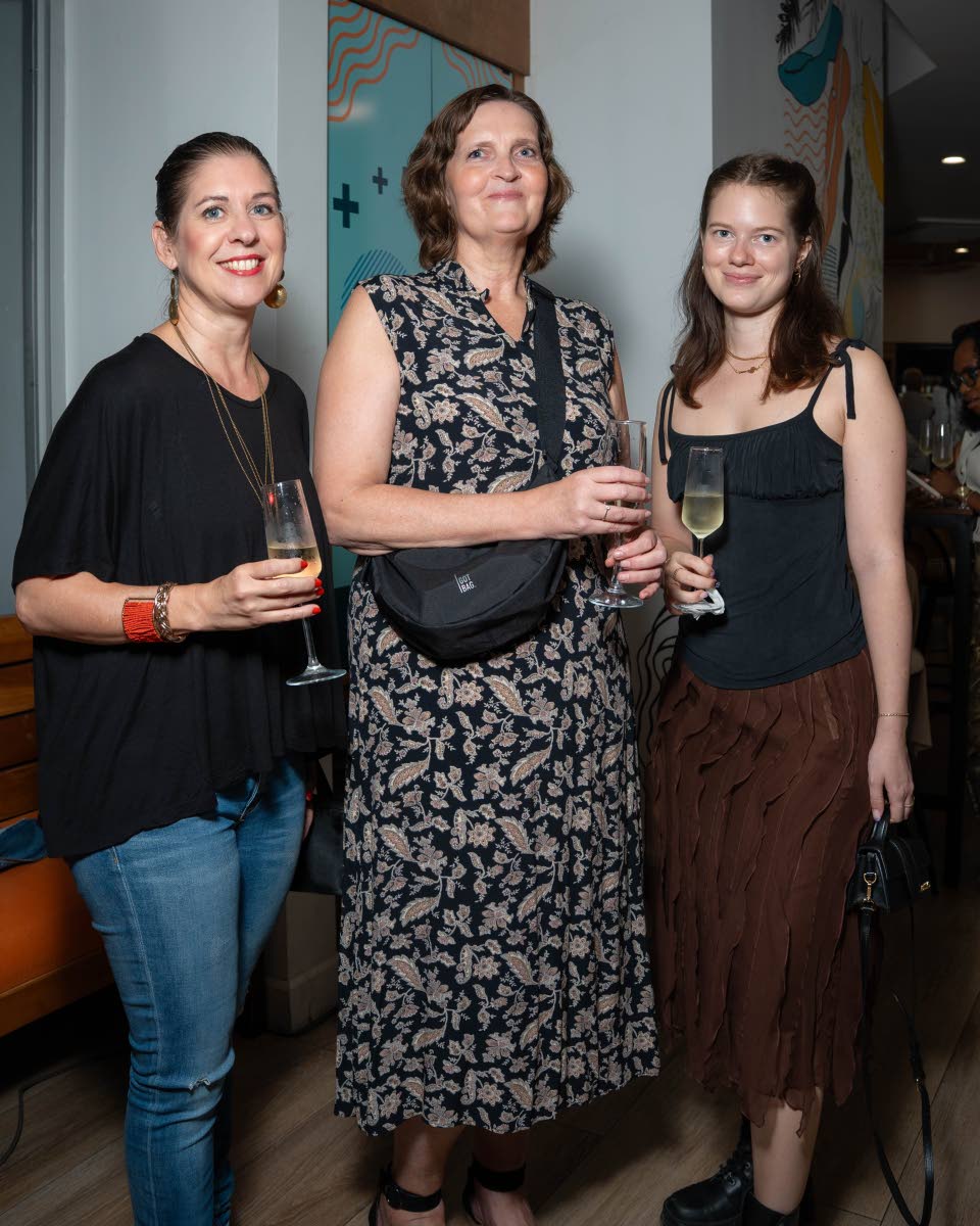 From left: Kristina Nigbur-Sammy, deputy head of mission; Stefanie Meyruhn, assistant attaché; and Taru Brügemann, head of legal and consular affairs at the German Embassy in Jamaica, are spotted enjoying the literary flair.