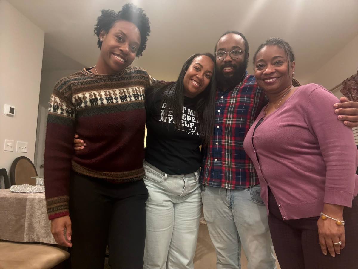 From left: Three of Godfrey’s six children – Emmanuela, Christina, Zoe – and his fiancée April.