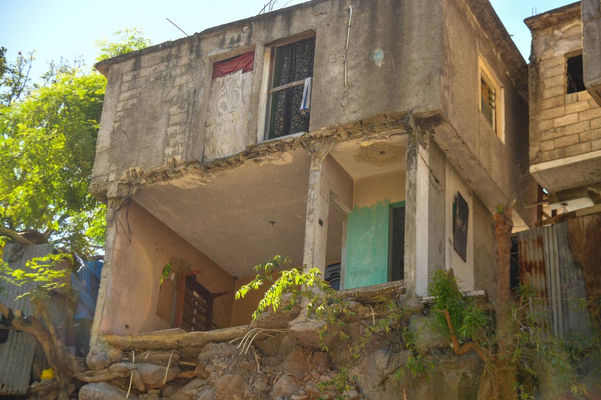 Perched on the edge of the Hope River, these homes face daily danger as the weakening embankment continues to crumble beneath them.