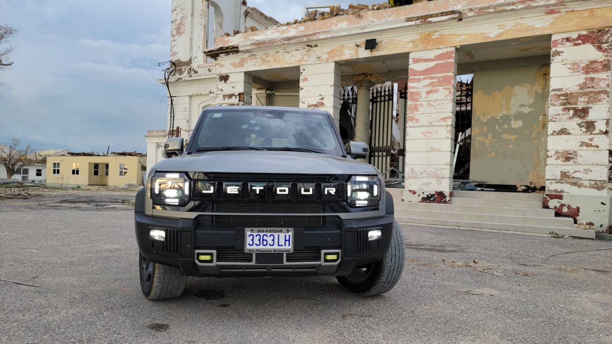 The rugged face of the T2, showcasing its wide stance and distinctive signature lights, ready for any adventure.