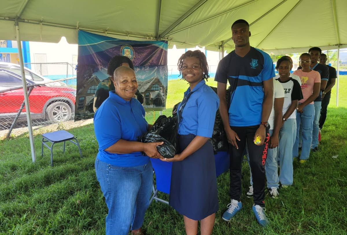 Far left, Jackie Josephs Haughton, board member of Manning’s Past Students Association York Chapter, presenting care packages to the students at Manning’s School 