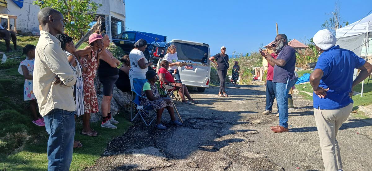Dr Ben Yisrael (second from right) addresses members of the Mount Airy community in Westmoreland on Sunday.