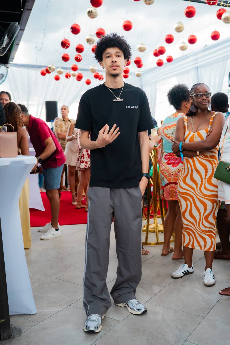 Taking a break from the turntables, DJ Kryptic poses for the camera.