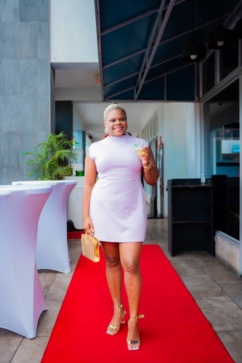 With drink in hand, Attorney Rishille Brown is ready to have a good time.