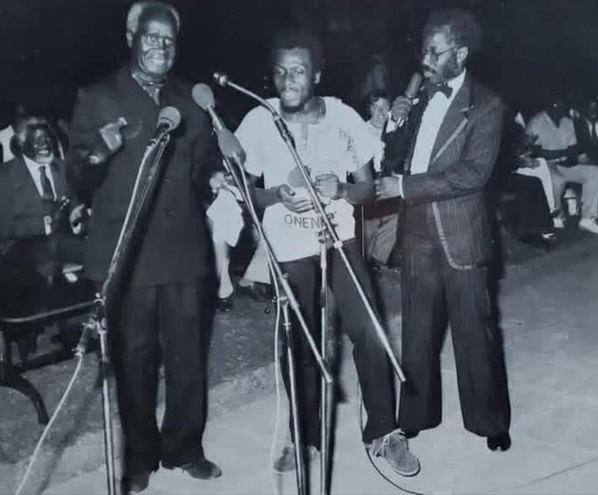 Jimmy Cliff in Zambia in 1982.  Pictured are: (from left) President Kenneth Kaunda of Zambia; Jimmy Cliff, and Mumba Kapumpa, Director of the Zambian Arts Council. Seated behind President Kaunda is Sam Nujoma, then leader of the SWAPO liberation movement a