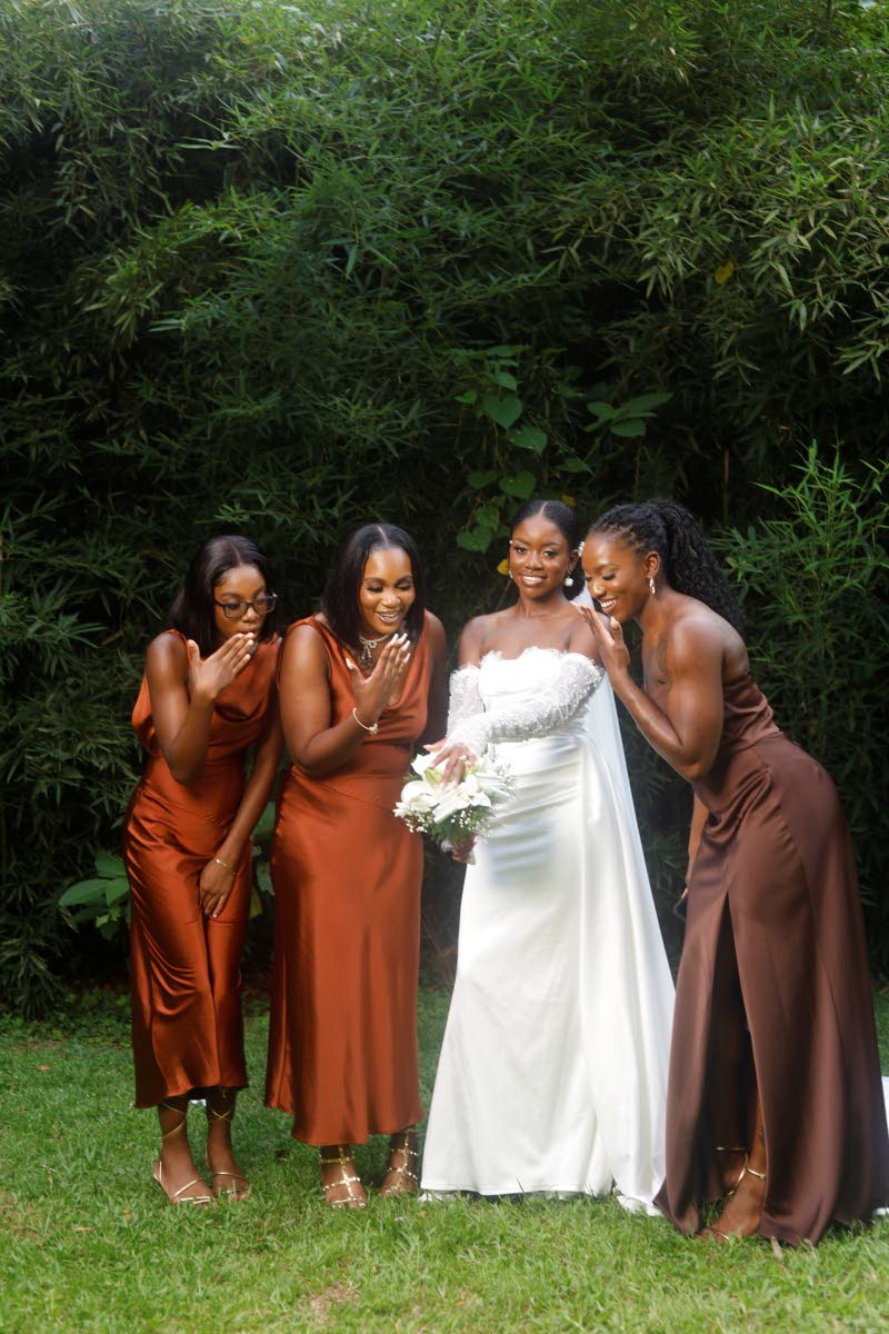 Jahnell (centre) shows off her ring to her bridesmaids (from left) Stevelle McDonald, Shanique McDonald, and Shantae McDonald, maid of honour.
