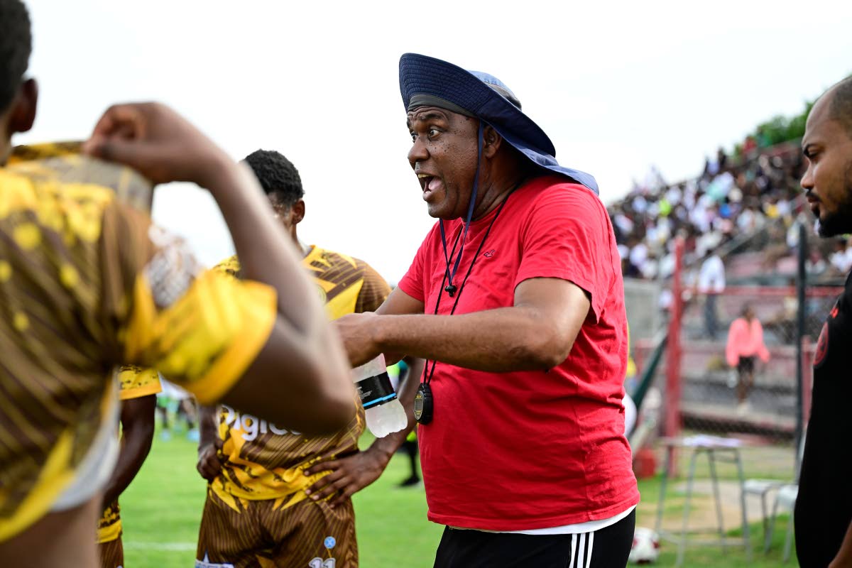 Charlie Smith coach Eugene Williams remonstrates with his charges during an ISSA/WATA Manning Cup fixture.