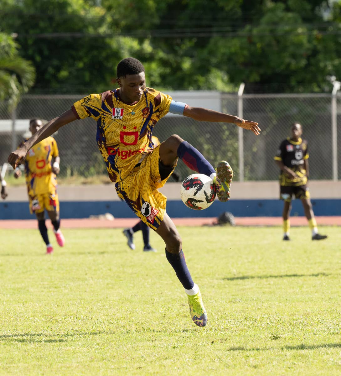 St Andrew Technical High School’s Richard Livingston controls a ball during a game against Kingston Technical High School at the Jamaica College Ashenheim Stadium on October 28.