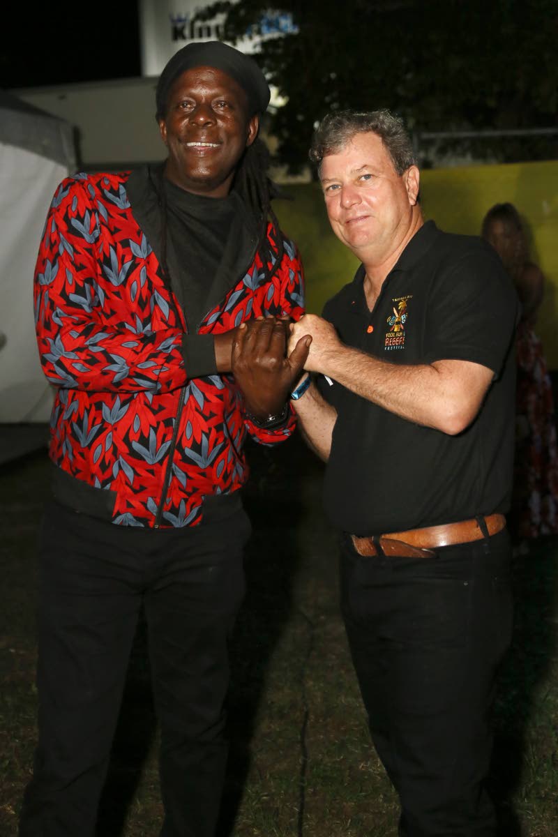 Richie Spice greets festival director Jason Henzell, moments after his surprise appearance.