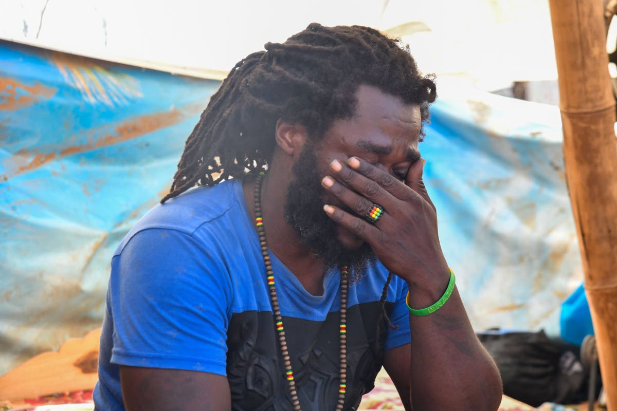 Jermaine Tomlinson sheds tears as he recounts his home being reduced to rubble and his efforts to save his family during Hurricane Melissa, in the community of Farm, Westmoreland.