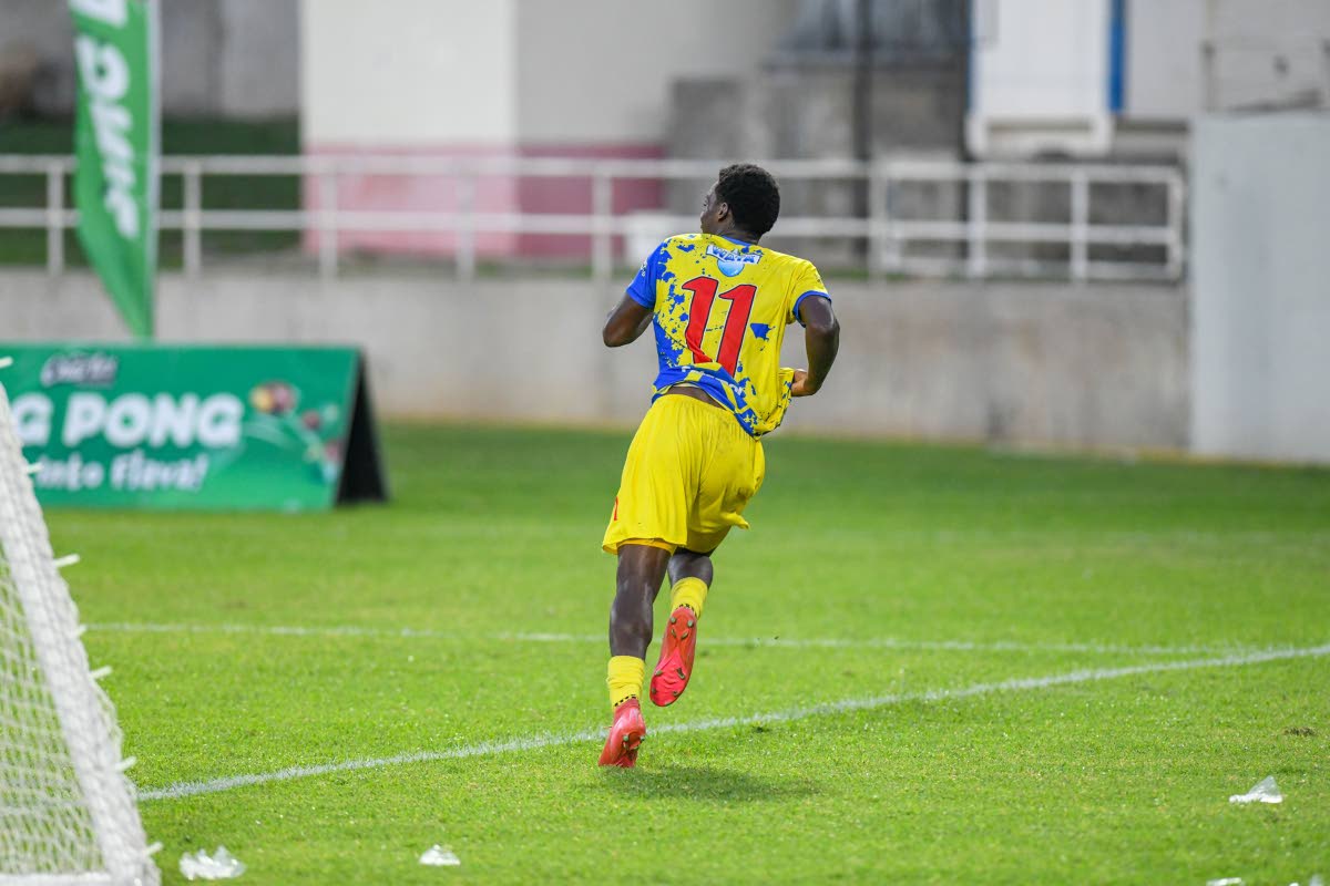 St Elizabeth Technical High School’s Kenoy Banton celebrates after scoring the lone goal of the daCosta Cup semi-final encounter against Kremps Hill High School at Sabina Park yesterday.