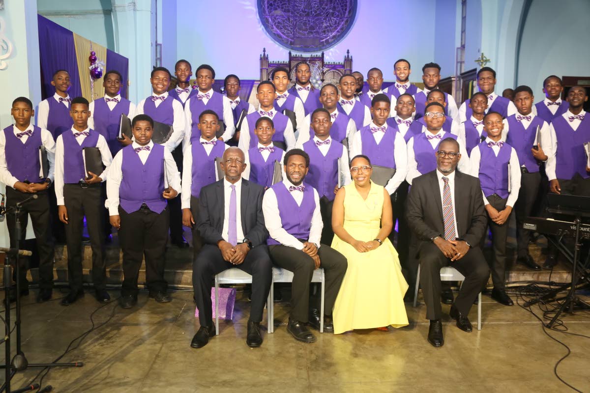 The Kingston College Chapel Choir is joined by (seated, from left) Michael Vaccianna, board chairman of Kingston College; Lloyd McEwan Jnr., chairman of the choir committee;  Karnette Batchelor Evering, administrator on the KC management team, and Audley D