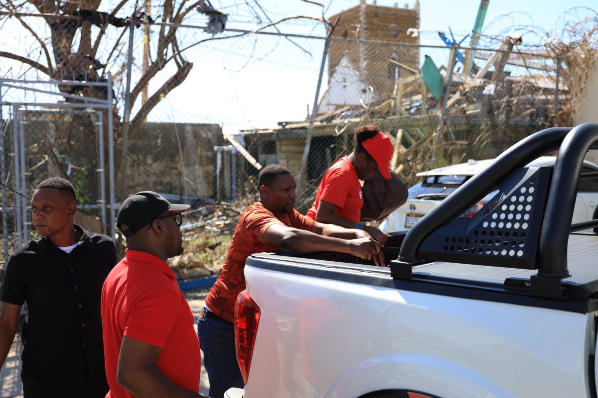 Members of the Fidelity Motors Group are seen delivering essential relief packages to families, diligently working to restore lives and communities after the passing of Hurricane Melissa.