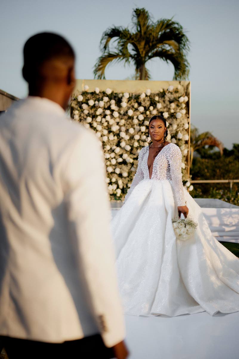 From the groom’s perspective, Leon looks on at his wife, Kimberley, with clear admiration.