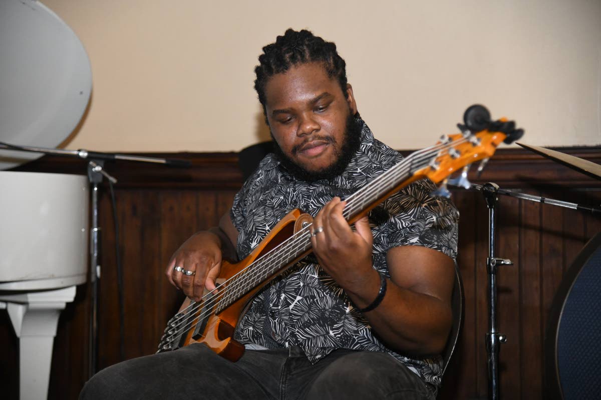 Alejandro Keating on the bass guitar at Thursday Night Jazz.