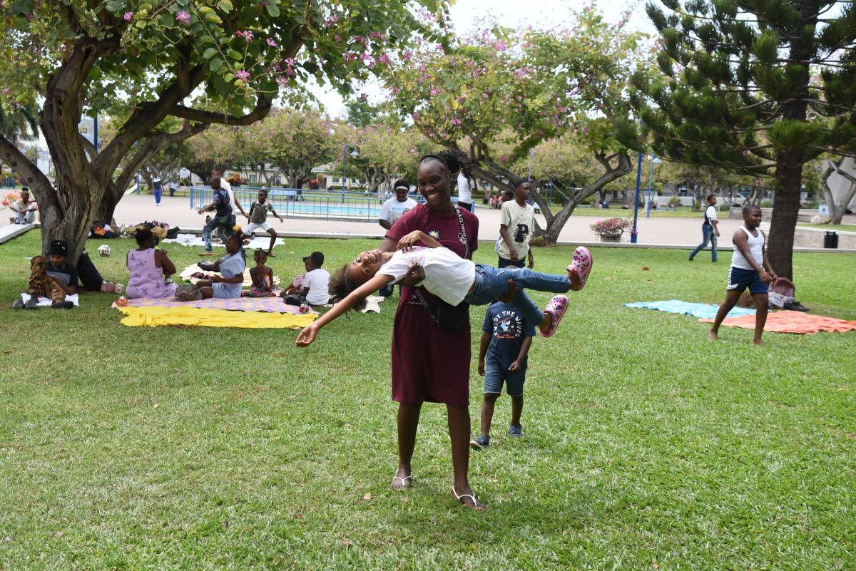 Children from the Bible Truth Ministry International (BTMI) enjoy themselves at Emancipation Park in New Kingston during an excursion earlier this year.
