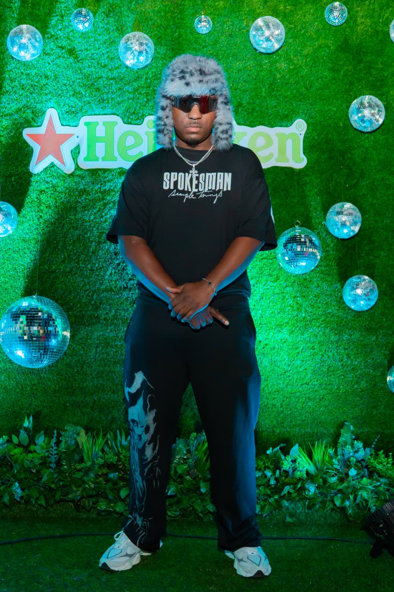 Dr George Scarlett gives Euro energy in a fur-style trapper hat with ear flaps.