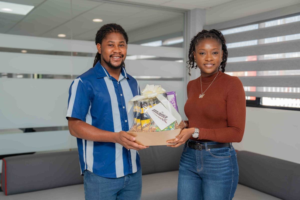 Malta Junior Brand Manager Laurice Griffiths presents Roshaun Wynter with a token of appreciation for his selfless leadership.