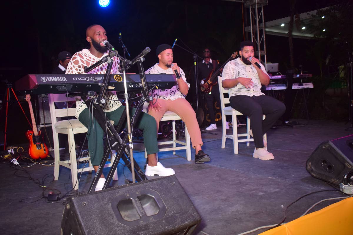 From left: Adiel ‘King Diel’ Thomas, Justin ‘Just King’ Walker, and Carl ‘Lee Lee King’ Scharschmidt of the musical group Island Kings entertain the audience at the Kings of Christmas concert, held at Sunken Garden in Hope Botanical Gardens on 