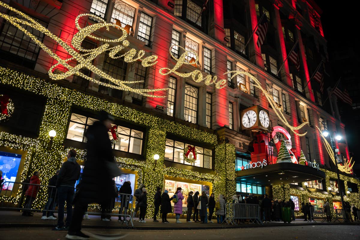 
Shoppers wait in line to enter Macy’s flagship store on November 28, 2025 in New York.