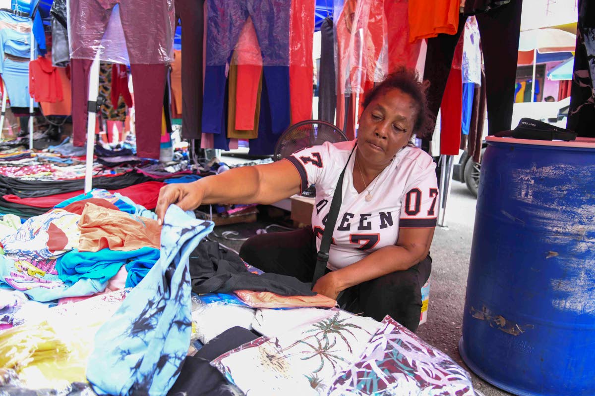 Clothing vendor Maureen Daley said she adjusted her pricing strategy to suit consumers’ limited spending power.