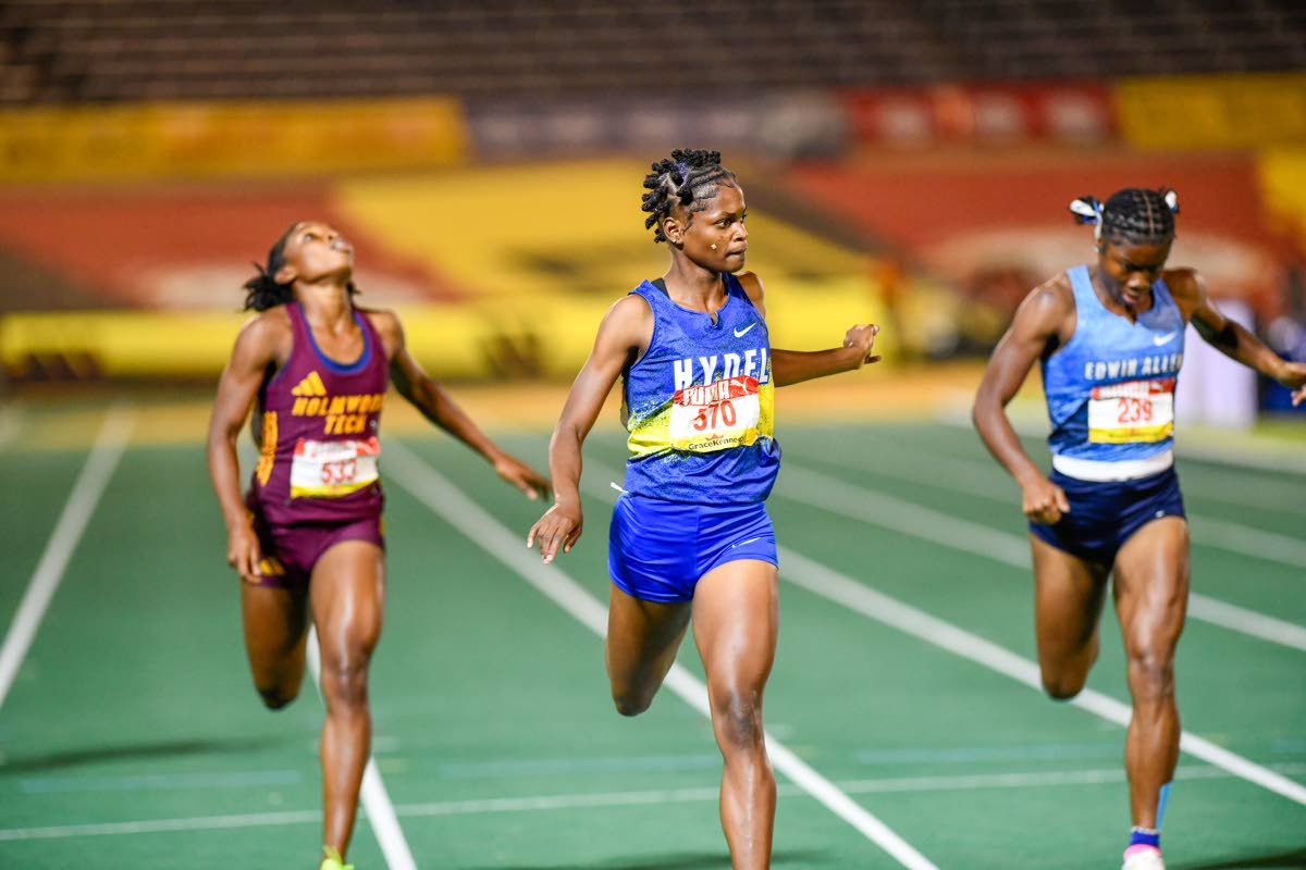 Abigail Campbell (centre) of Hydel High School wins last year’s Class One Girls 400m final in 53.03 seconds ahead of Abrina Wright (left) of Holmwood Technical and Edwin Allen High’s Kellyann Carr  at last year’s ISSA/Grace Kennedy Boys and Girls’ 