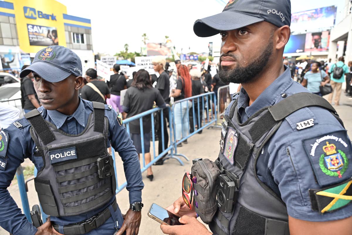 File Photos
Police officers wearing body cameras at the JFJ-organised peaceful protest in Half-Way Tree, St Andrew, last April.