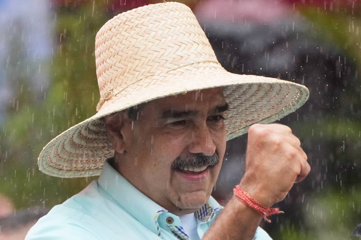 President Nicolas Maduro addresses supporters during a rally marking the anniversary of the Battle of Santa Ines, which took place during Venezuela’s 19th-century Federal War, in Caracas, Venezuela, Wednesday, Dec. 10, 2025. (AP Photo/Ariana Cubillos)