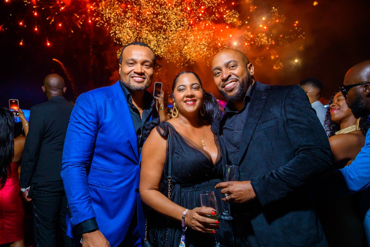 From left: Heineken brand manager Nathan Nelms, Trade Marketing Manager Anjelica Holmes, and her husband Kirk Holmes soak in the festivities at Frenchmen Climax, with fireworks framing the night, capping off an evening to remember.