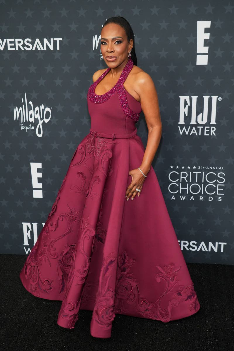 Sheryl Lee Ralph dons a deep burgundy Tony Ward Couture gown with handcrafted 3D embroidered motifs and jewellery by Selim Mouzannar. 