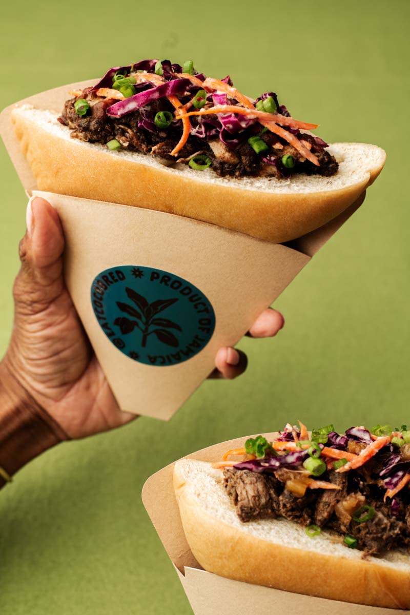 Coco Bred’s jerk bird (left), jerk chicken, topped with a scallion-ginger sauce, pickled pineapple, and plantain crunch and the Passa Passa pork, jerk-inspired pork with carrot-ginger slaw and a tamarind chutney.