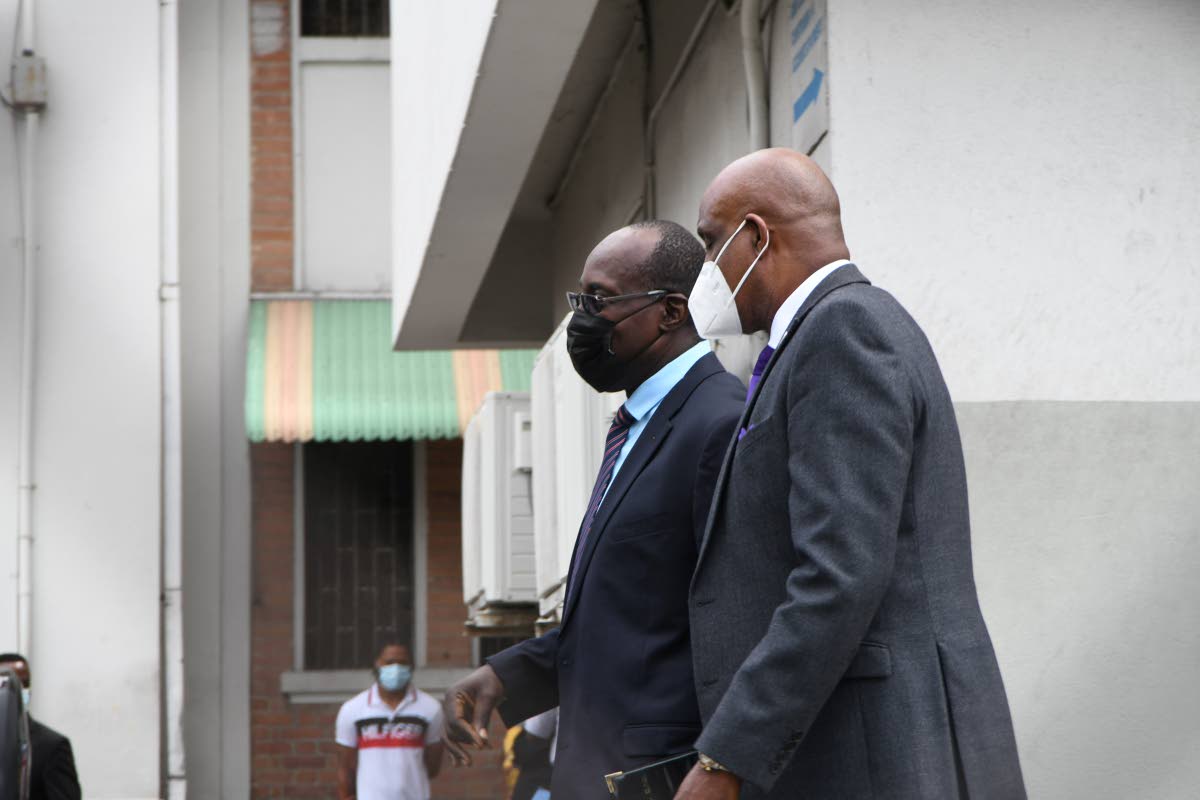 Ruel Reid (left), former education minister, and Fritz Pinnock, former president of the Caribbean Maritime University.