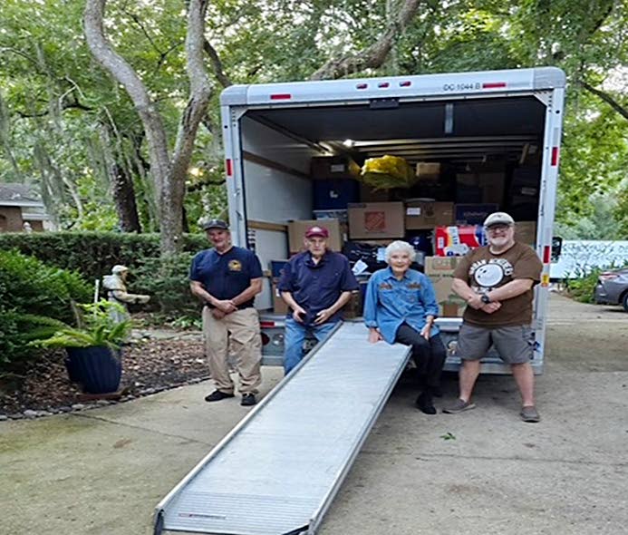 A truck is being loaded in Florida to be shipped to Jamaica with the help of Dame Linda Keller and volunteers. 
