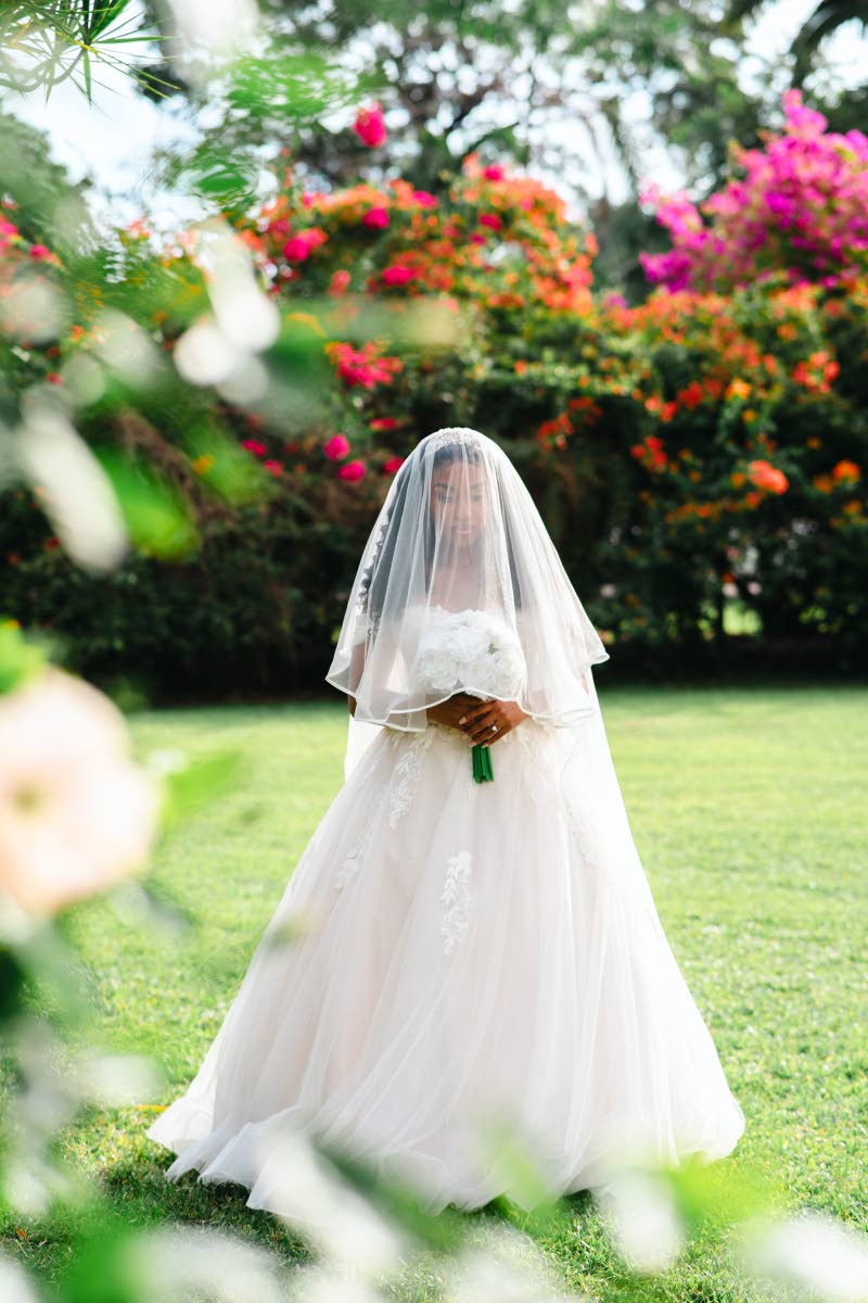 Radiant in white, Danielle beams as she prepares for the rest of her life with Adriel. 