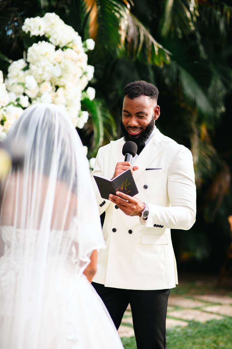 The groom reads his handwritten vows to his bride.