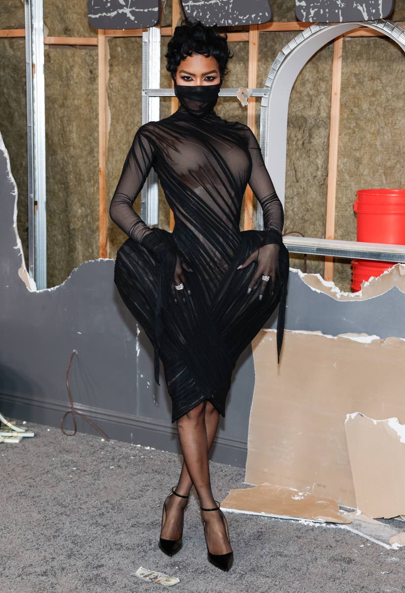 Teyana Taylor commands attention in a black sculptural design by Ashi Studio, the fashion house behind Kylie Jenner’s custom hand-embroidered Golden Globes look.