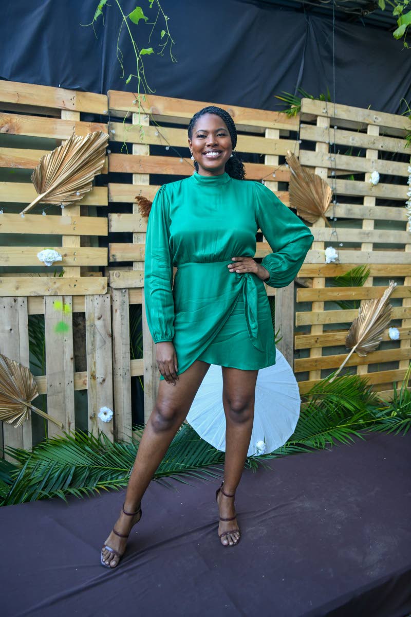 Left: Rickie-Ann Witter shows off her green faux wrap mini while rocking a radiant smile for the camera.