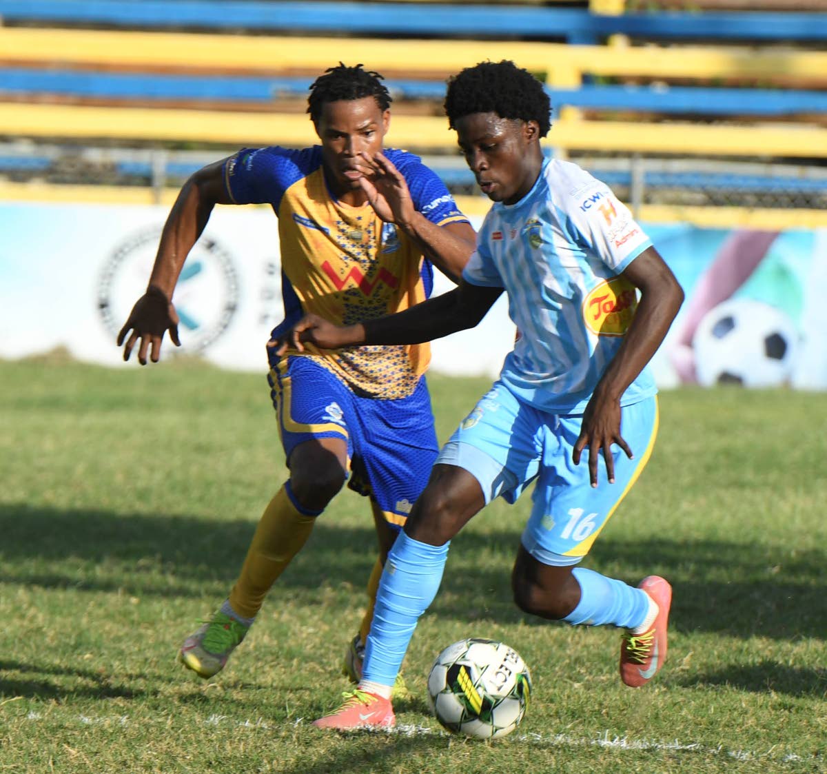 Harbour View’s Luca’ Kung (left) chases after Waterhouse’s Duwayne Burgher during a Jamaica Premier League fixture at the Harbour View Mini-Stadium in Kingston yesterday.