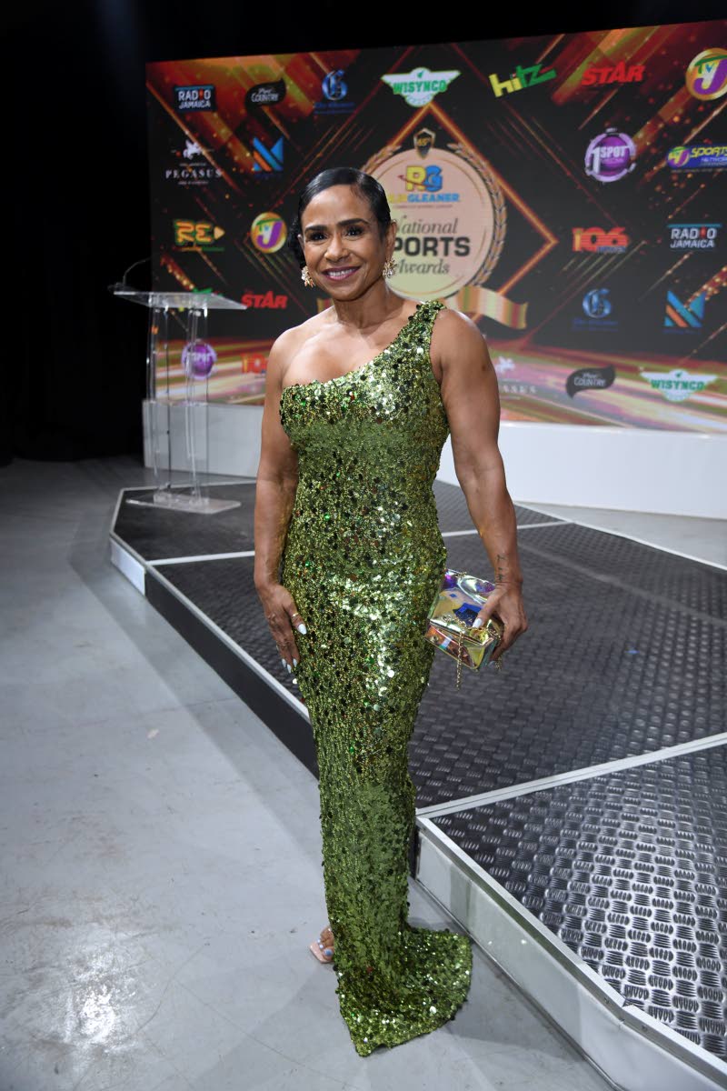 Audrie Allwood, president of the Jamaica Amateur Bodybuilding and Fitness Association, stands out in this one-shoulder curve-hugging sequin dress.