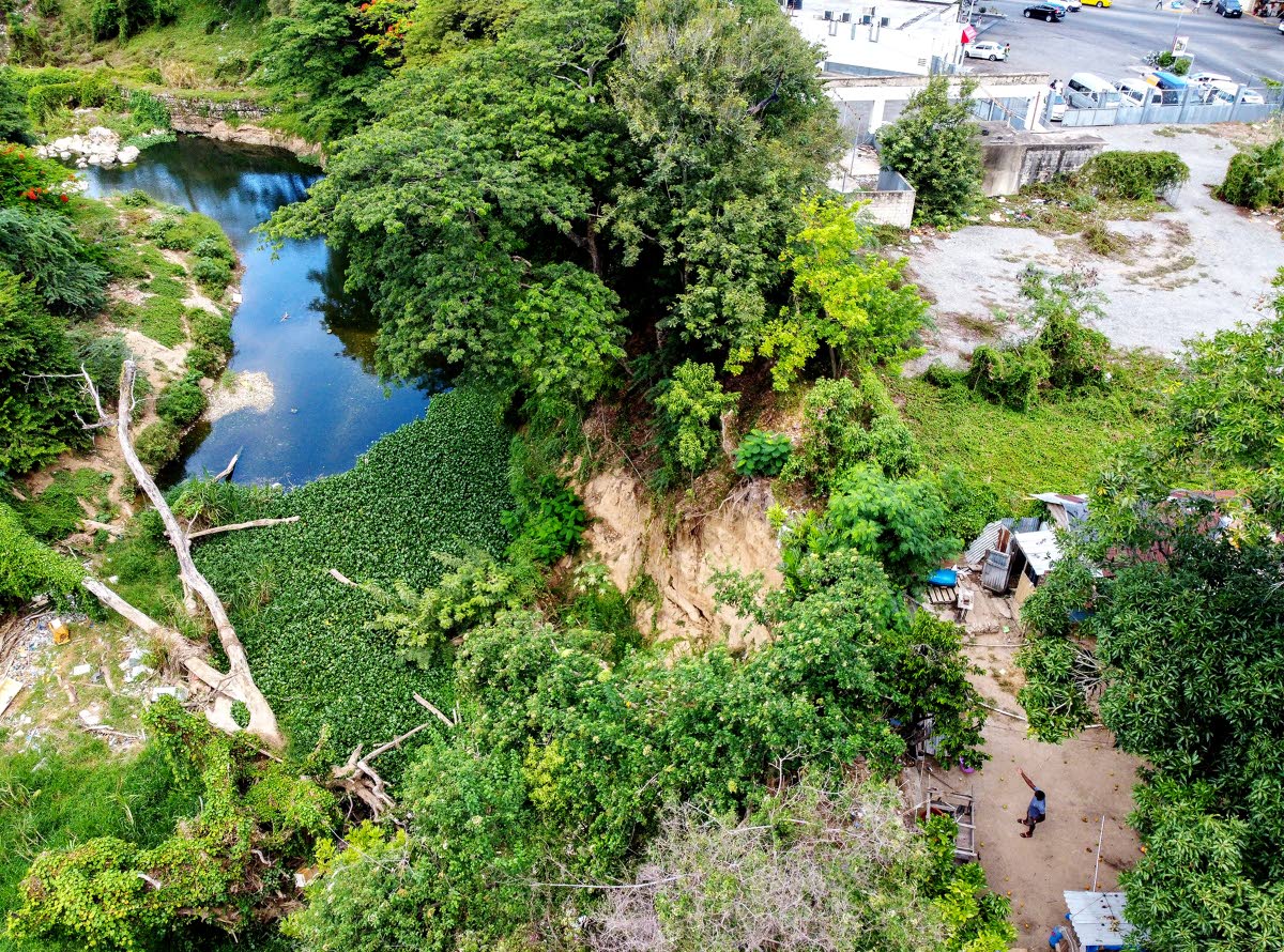 An aerial photograph of a house on Barrett Street in Spanish Town, St Catherine on Friday, July 17, 2020. The dwelling inches closer to the Rio Cobre with each heavy downpour of rainfall, as a result of soil erosion. 