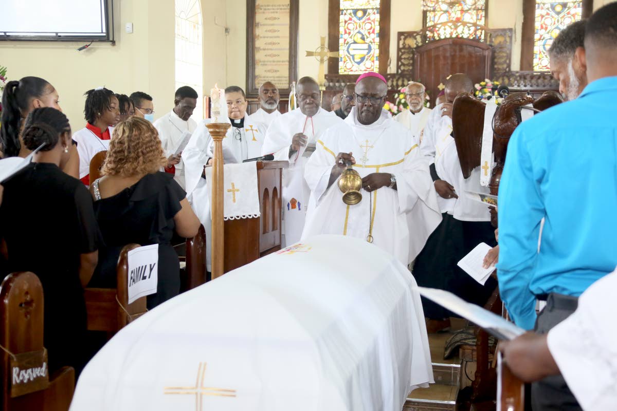 Reverend Leon P. Golding, Bishop of Jamaica and the Cayman Islands, performs the last rites at the funeral service of Alvarine Roberts at St Gabriel’s Anglican Church in May Pen, Clarendon, yesterday.