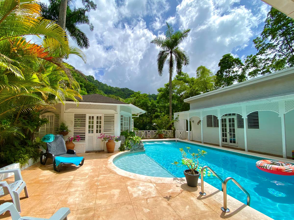 As incredible as it may seem, this house exists in a deep river valley at the base of the Blue Mountains.