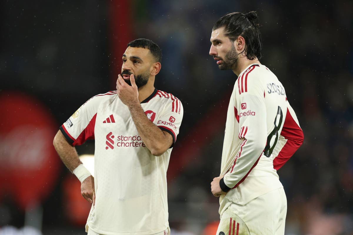 
Liverpool’s Mohamed Salah (left) and teammate Dominik Szoboszlai talk before a direct free kick from which the latter scored his sides second goal during an English Premier League football match against Bournemouth in Bournemouth, England, yesterday.